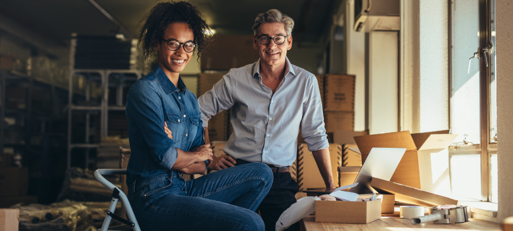 man and woman smiling at their home business