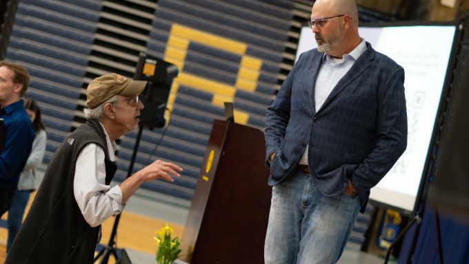 Older man talking to Ryan Busee from 2025 Casley lecture