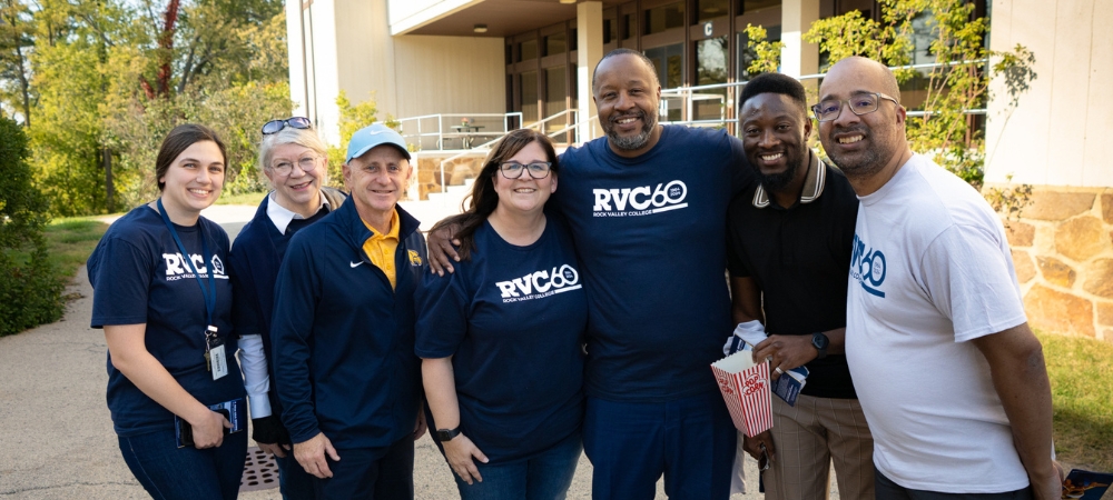group of college employees wearing RVC 60 shirts
